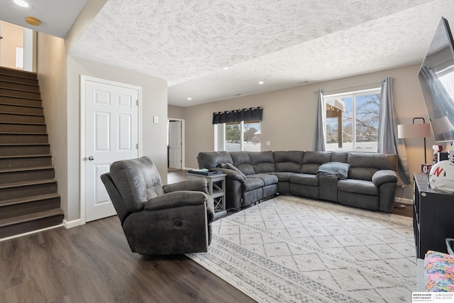 4706 S 187th Ave, Omaha, NE 68135 - living room featuring wood finished floors, stairway, a textured ceiling, recessed lighting, and baseboards