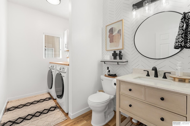 4706 S 187th Ave, Omaha, NE 68135 - bathroom featuring washer and dryer, vanity, and baseboards