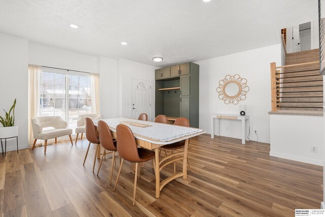 4706 S 187th Ave, Omaha, NE 68135 - dining room with wood finished floors, recessed lighting, stairs, and baseboards