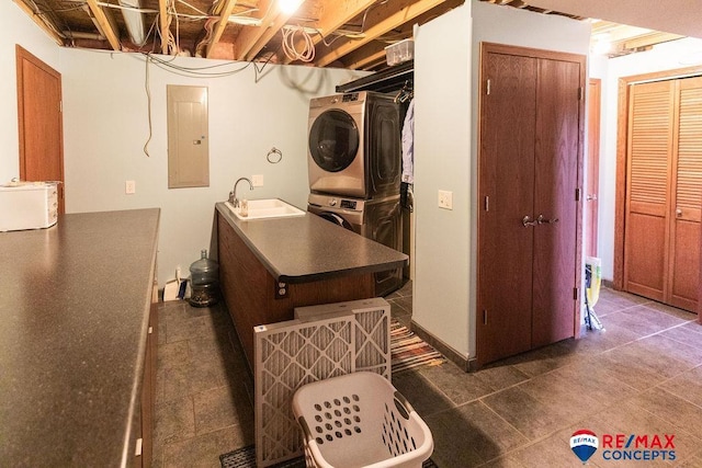 29300 S Golden Pond Rd, Firth, NE 68358 - laundry room with stacked washer / drying machine, electric panel, a sink, and tile patterned flooring