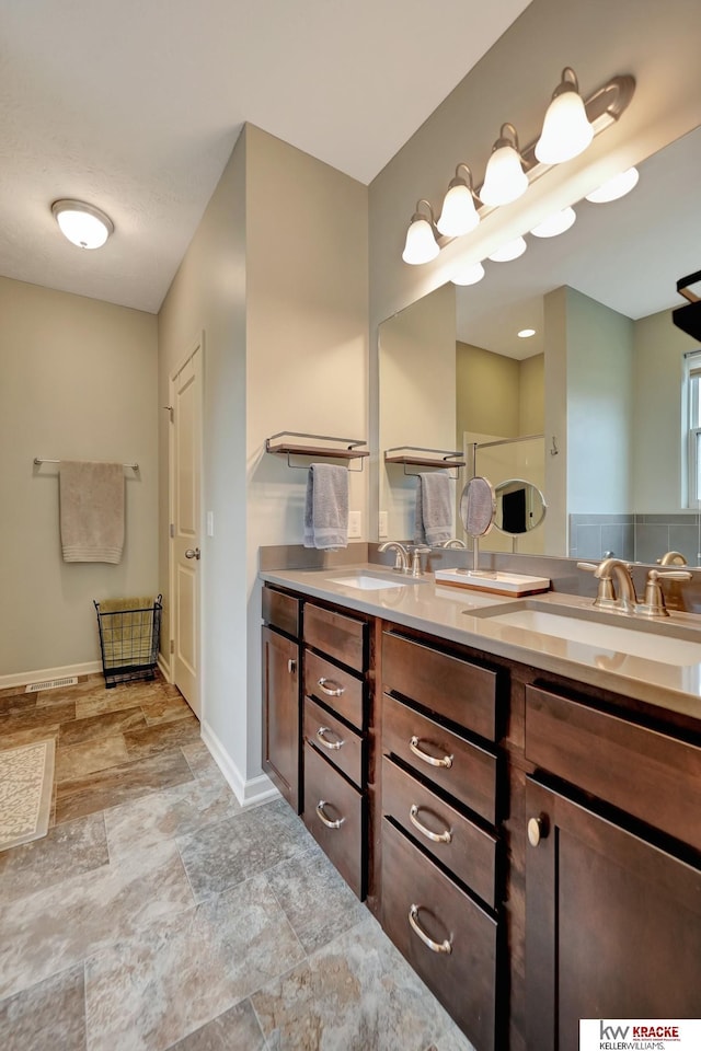 7237 Yankee Woods Dr, Lincoln, NE 68516 - full bath featuring stone finish flooring, double vanity, and baseboards