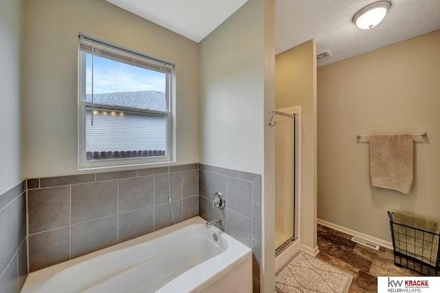 7237 Yankee Woods Dr, Lincoln, NE 68516 - full bathroom featuring a bath, a stall shower, and baseboards