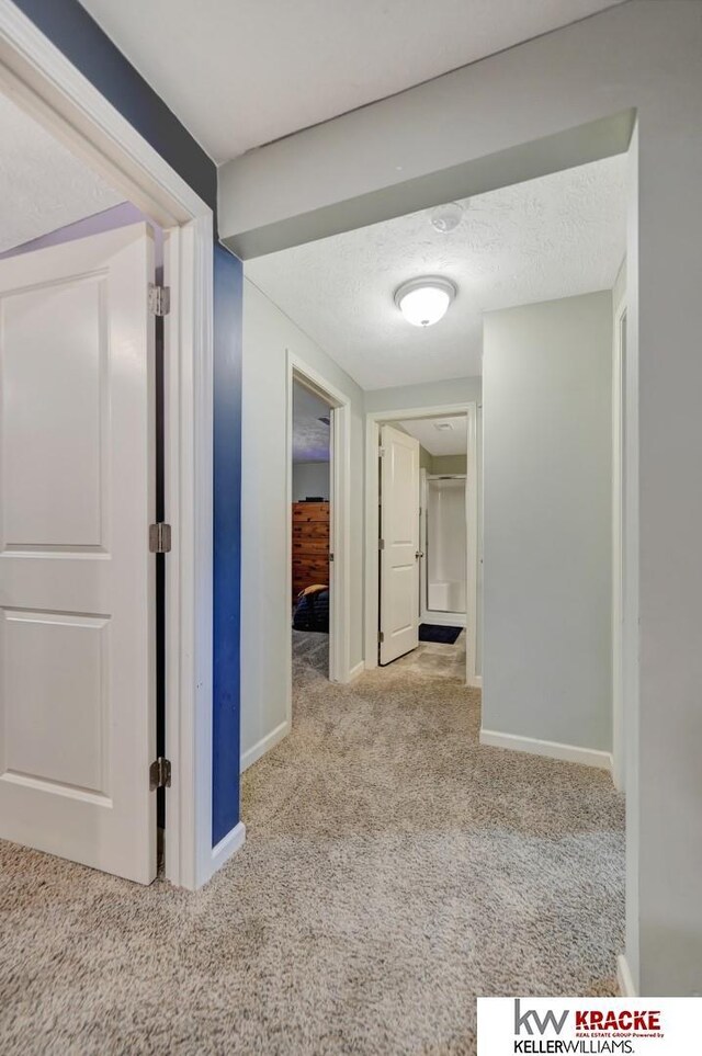 7237 Yankee Woods Dr, Lincoln, NE 68516 - corridor featuring carpet floors and baseboards