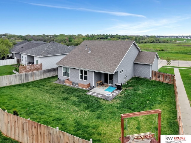 7237 Yankee Woods Dr, Lincoln, NE 68516 - back of house with roof with shingles and a patio area