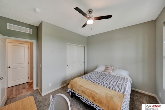 7237 Yankee Woods Dr, Lincoln, NE 68516 - bedroom featuring carpet flooring, baseboards, a ceiling fan, and a closet