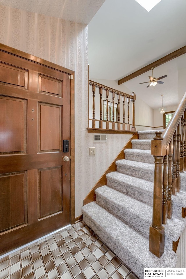 1115 Arbor Ridge Dr, Council Bluffs, IA 51503 - entrance foyer with wallpapered walls, stairway, ceiling fan, and baseboards