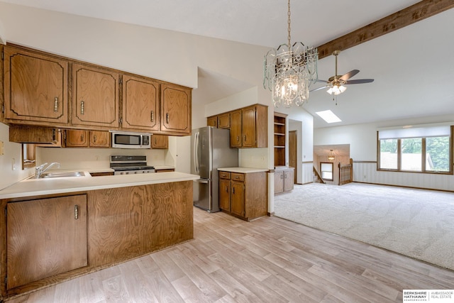 1115 Arbor Ridge Dr, Council Bluffs, IA 51503 - kitchen featuring appliances with stainless steel finishes, a sink, a ceiling fan, high vaulted ceiling, and open floor plan
