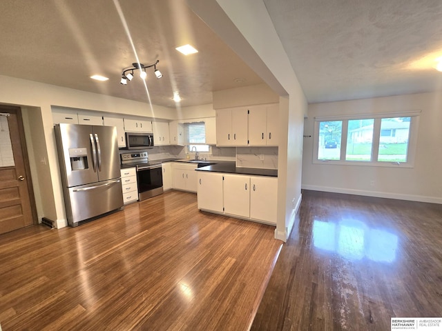 713 Janes View St, Papillion, NE 68046 - kitchen featuring stainless steel appliances, a sink, dark wood-type flooring, baseboards, and white cabinetry