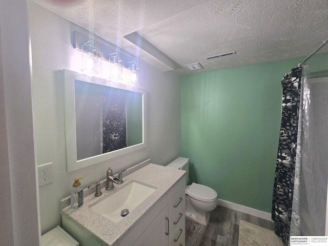 713 Janes View St, Papillion, NE 68046 - bathroom with wood finished floors, a textured ceiling, toilet, vanity, and a shower with shower curtain