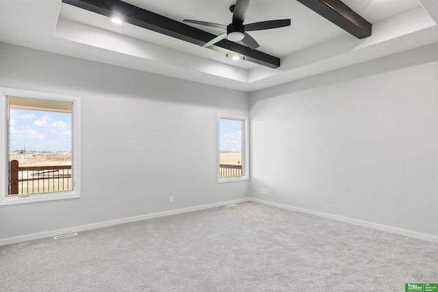 5408 N 196th Ave, Elkhorn, NE 68022 - carpeted spare room featuring beamed ceiling, baseboards, ceiling fan, and a tray ceiling