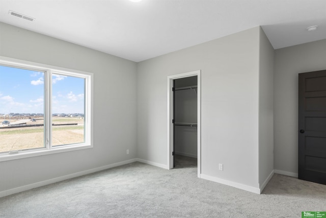 5408 N 196th Ave, Elkhorn, NE 68022 - unfurnished bedroom with carpet flooring, baseboards, a spacious closet, and a closet