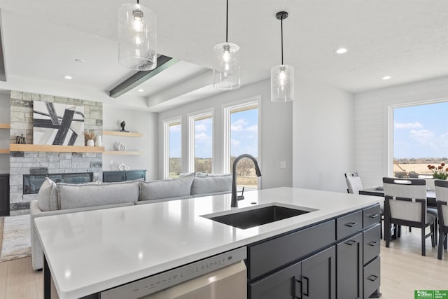 5408 N 196th Ave, Elkhorn, NE 68022 - kitchen with stainless steel dishwasher, a sink, plenty of natural light, light wood-style flooring, and recessed lighting