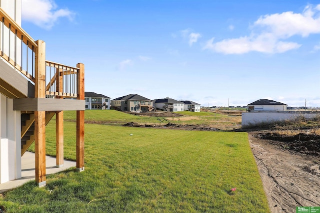 21125 Arlington St, Elkhorn, NE 68022 - view of green lawn with a residential view and a patio