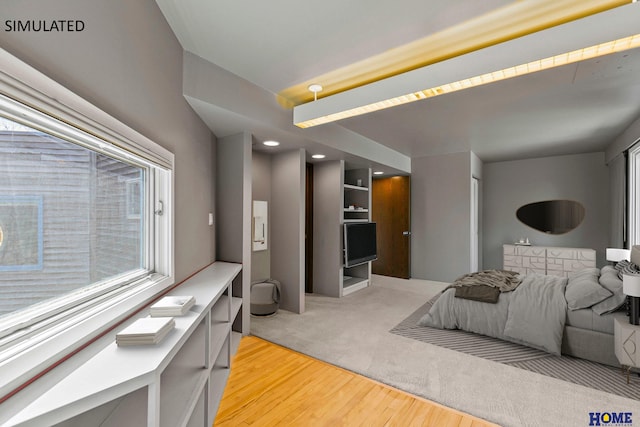 4144 S 88th St, Lincoln, NE 68520 - bedroom featuring multiple windows and light wood-style flooring