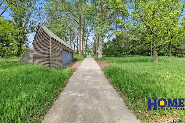 4144 S 88th St, Lincoln, NE 68520 - view of home's community with a detached garage and an outbuilding