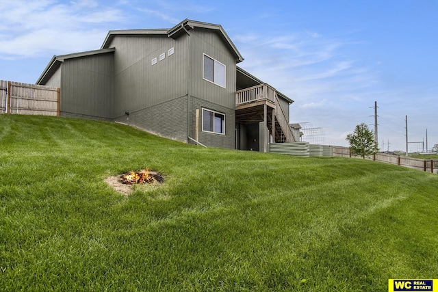 17820 Rampart St, Omaha, NE 68136 - back of house with a fire pit and a deck