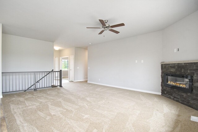 17820 Rampart St, Omaha, NE 68136 - unfurnished living room featuring a ceiling fan, carpet, a fireplace, and baseboards