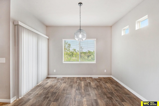17820 Rampart St, Omaha, NE 68136 - unfurnished dining area with dark wood finished floors and baseboards