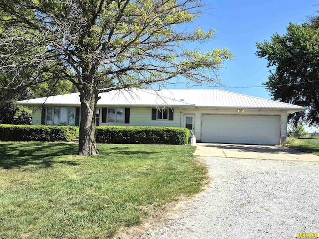 64070 67th Hwy, Peru, NE 68421 - ranch-style home featuring gravel driveway, a garage, a front yard, and metal roof