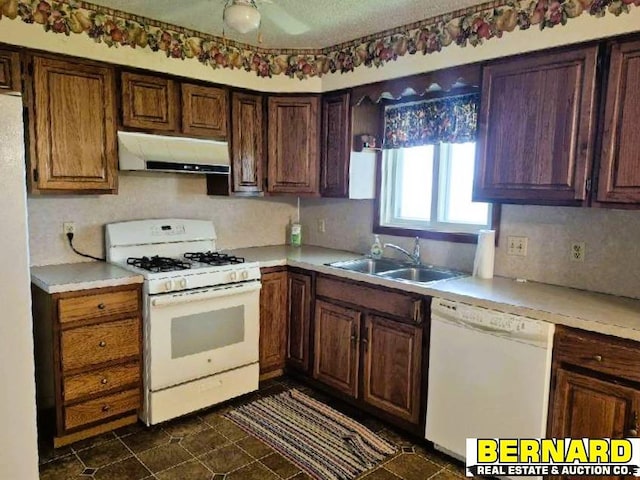 64070 67th Hwy, Peru, NE 68421 - kitchen featuring white appliances, under cabinet range hood, a sink, light countertops, and ceiling fan