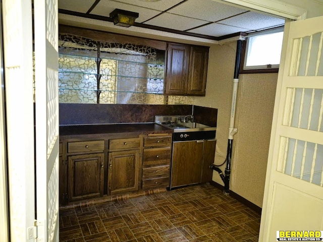 64070 67th Hwy, Peru, NE 68421 - kitchen with brick patterned floors, dark countertops, and baseboards