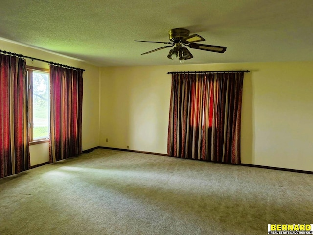 64070 67th Hwy, Peru, NE 68421 - carpeted empty room with baseboards, ceiling fan, and a textured ceiling