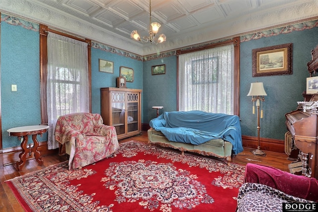 450 W 6th St, Fremont, NE 68025 - living area with hardwood / wood-style flooring, an ornate ceiling, healthy amount of natural light, and baseboards