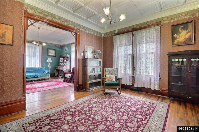 450 W 6th St, Fremont, NE 68025 - living area with a chandelier, wallpapered walls, wood-type flooring, and an ornate ceiling
