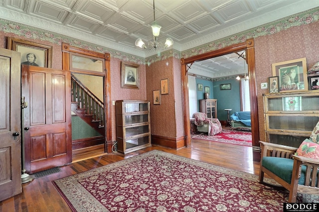 450 W 6th St, Fremont, NE 68025 - entrance foyer with dark wood-type flooring, a chandelier, baseboards, stairs, and an ornate ceiling