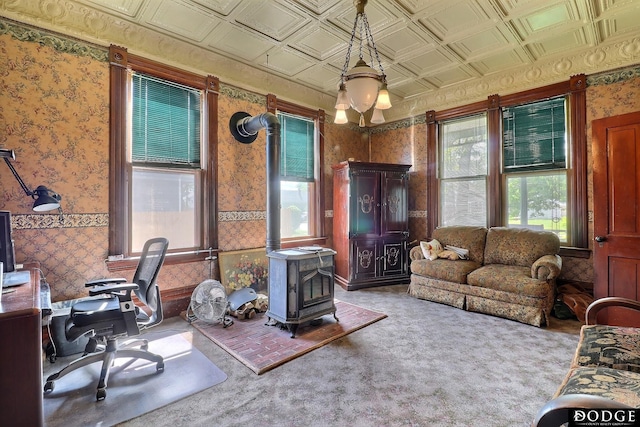 450 W 6th St, Fremont, NE 68025 - carpeted office featuring wallpapered walls, a wood stove, plenty of natural light, and an ornate ceiling