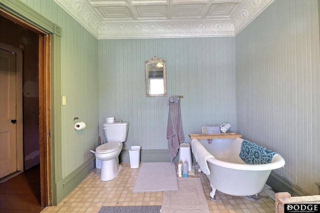 450 W 6th St, Fremont, NE 68025 - full bath with an ornate ceiling, a soaking tub, toilet, and tile patterned floors