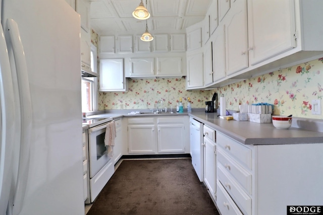 450 W 6th St, Fremont, NE 68025 - kitchen featuring white appliances, a sink, wallpapered walls, white cabinets, and light countertops