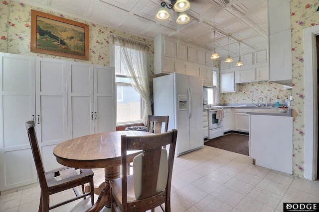 450 W 6th St, Fremont, NE 68025 - dining area featuring wallpapered walls and an ornate ceiling