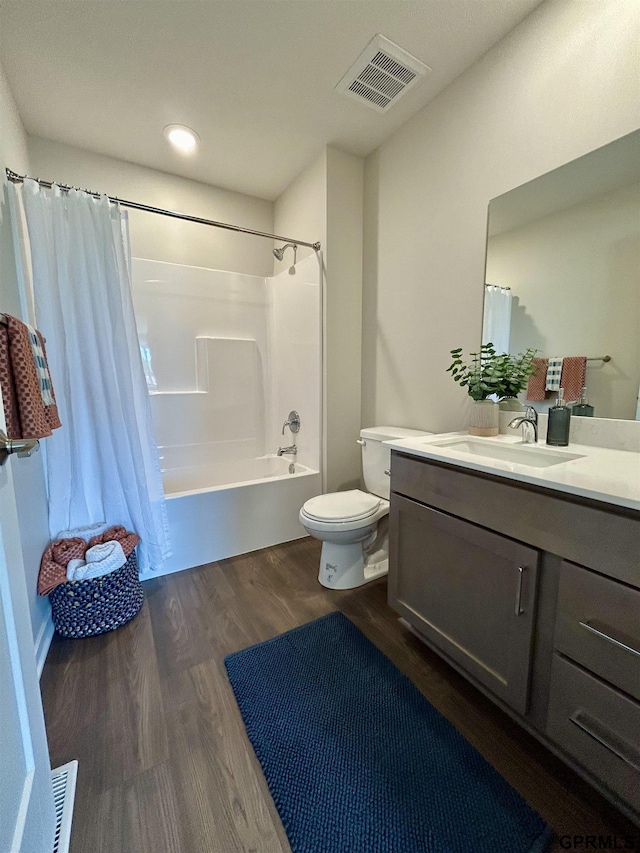 533 W Corsac Rd, Lincoln, NE 68523 - full bathroom with toilet, vanity, shower / bath combo with shower curtain, wood finished floors, and recessed lighting