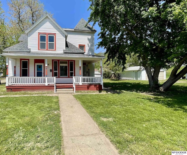608 Mill St, Council Bluffs, IA 51503 - view of front of house with a shingled roof, a front yard, and a porch