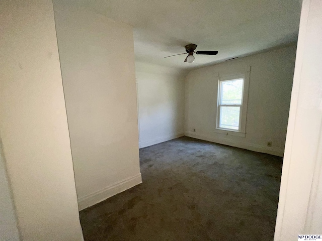 608 Mill St, Council Bluffs, IA 51503 - carpeted spare room featuring ceiling fan and baseboards