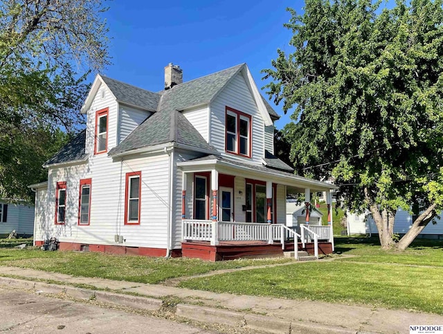 608 Mill St, Council Bluffs, IA 51503 - view of front facade featuring covered porch, roof with shingles, a front lawn, and a chimney