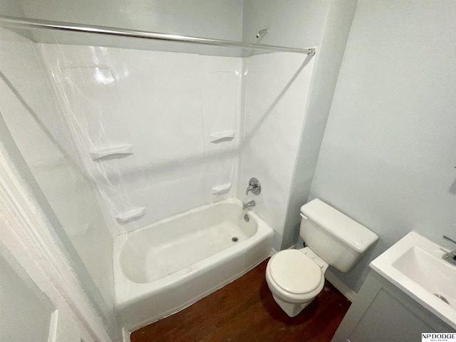 608 Mill St, Council Bluffs, IA 51503 - full bathroom featuring wood finished floors, shower / bath combination, toilet, and vanity