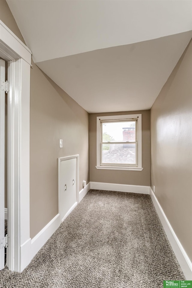 3520 N 55th St, Omaha, NE 68104 - carpeted spare room with lofted ceiling and baseboards