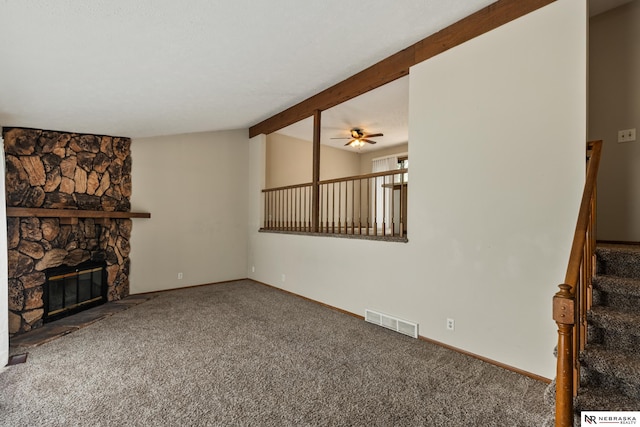 2211 Scarborough Dr, Bellevue, NE 68123 - unfurnished living room with carpet floors, a fireplace, ceiling fan, baseboards, and stairs