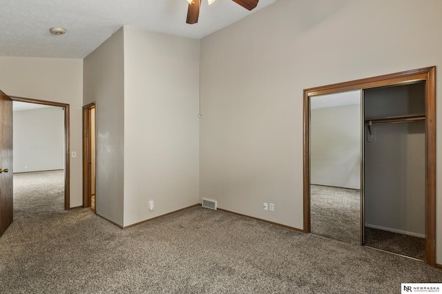 2211 Scarborough Dr, Bellevue, NE 68123 - unfurnished bedroom featuring carpet floors, a closet, a ceiling fan, and baseboards