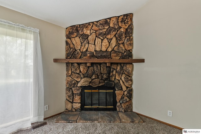 2211 Scarborough Dr, Bellevue, NE 68123 - detailed view of a fireplace, carpet floors, and baseboards