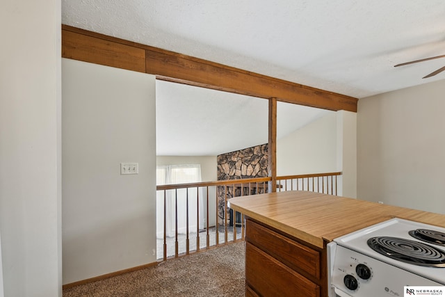 2211 Scarborough Dr, Bellevue, NE 68123 - kitchen featuring white range with electric stovetop, ceiling fan, carpet floors, and light countertops