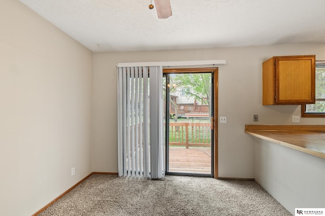 2211 Scarborough Dr, Bellevue, NE 68123 - unfurnished dining area featuring light carpet and baseboards