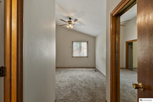2211 Scarborough Dr, Bellevue, NE 68123 - carpeted spare room featuring ceiling fan and lofted ceiling