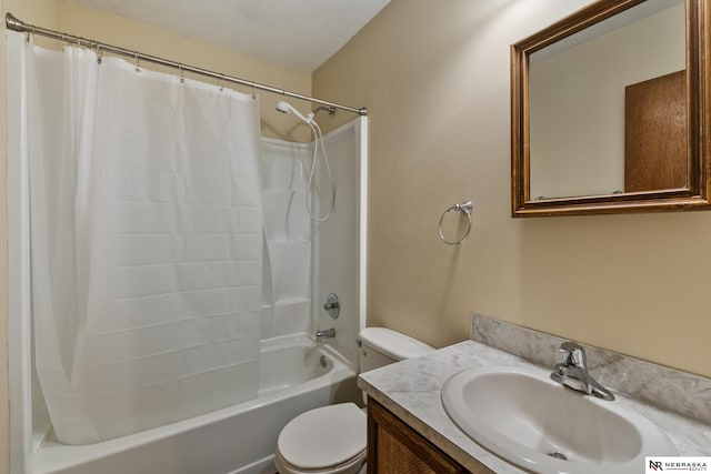 2211 Scarborough Dr, Bellevue, NE 68123 - full bathroom with toilet, shower / bath combo, vanity, and a textured ceiling