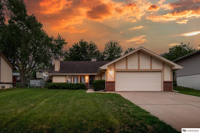 2211 Scarborough Dr, Bellevue, NE 68123 - view of front of house with brick siding, an attached garage, concrete driveway, and a chimney