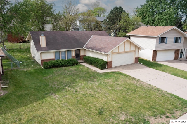2211 Scarborough Dr, Bellevue, NE 68123 - view of front facade with brick siding, driveway, a chimney, and an attached garage
