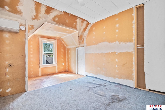 240 E 15th St, Fremont, NE 68025 - additional living space featuring a wall mounted air conditioner, lofted ceiling, and carpet