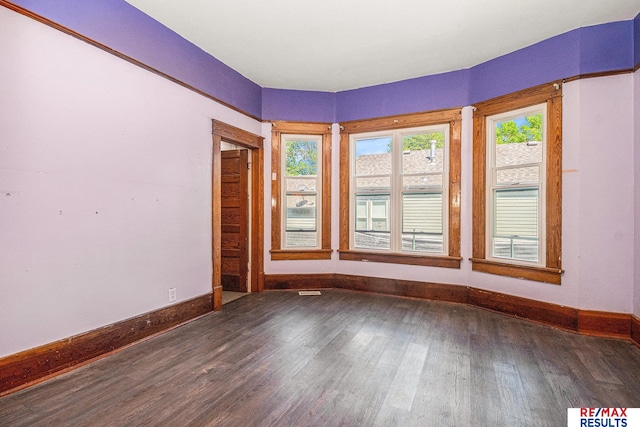 240 E 15th St, Fremont, NE 68025 - spare room with baseboards and dark wood-style flooring